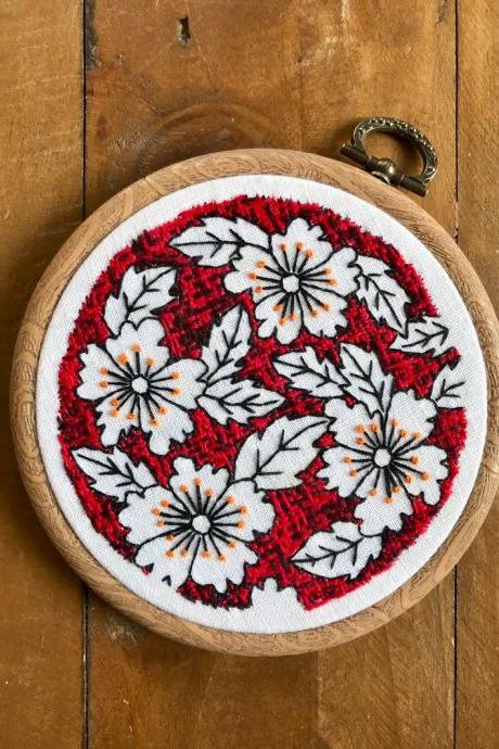 Red Pottery inspired hand embroidered hoop with red background